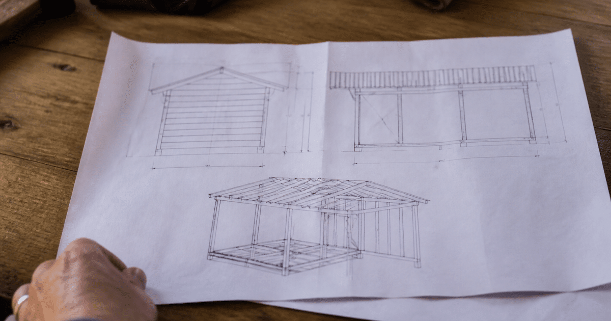 Document papier montrant plans techniques abri bois construction